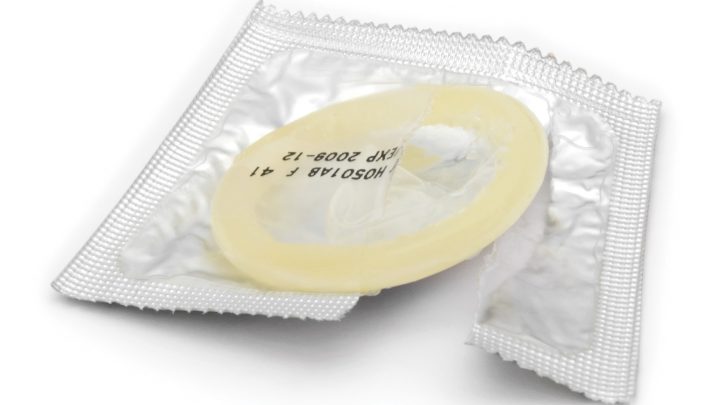Condom isolated on white background. Soft shadow